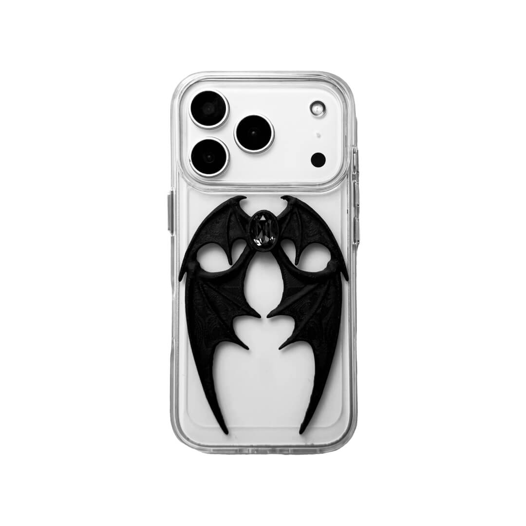 A high-fashion iPhone case featuring a pair of 3D-printed demon wings curving around a central sparkling gem, all in a natural matte black finish. Available in two variations: a minimalist Clear Transparent base and a luxurious Black Leather textured base, showcasing the intricate and edgy sculptural design.