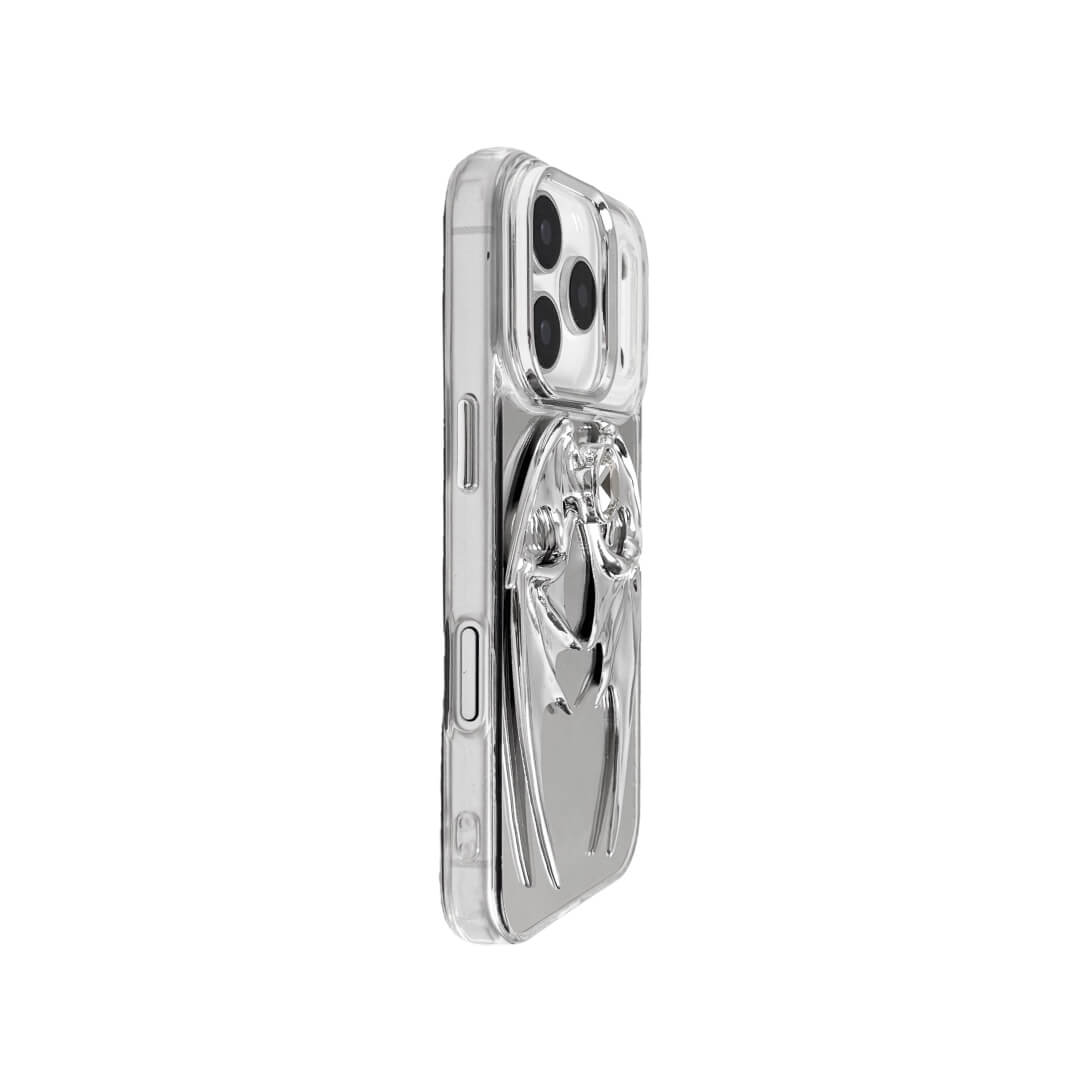 The Gem Demon Wings iPhone Case featuring 3D sculpted silver metallic bat-style wings with a central rhinestone. Shown with both White and Black gem options, available on Silver, Transparent, and Black case bases.
