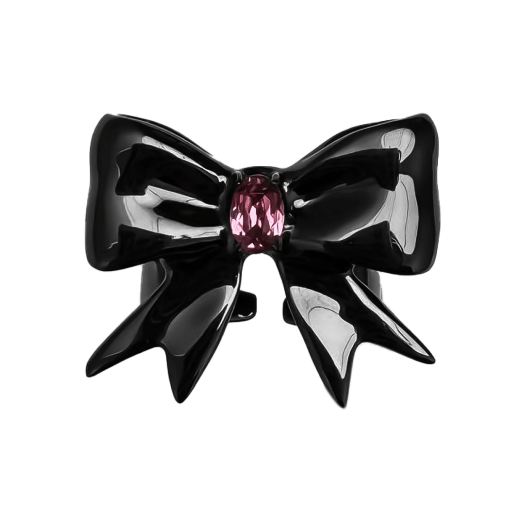 Stylish ribbon-shaped ring in silver and black with a pink Swarovski crystal accent.