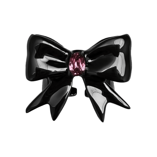 Stylish ribbon-shaped ring in silver and black with a pink Swarovski crystal accent.