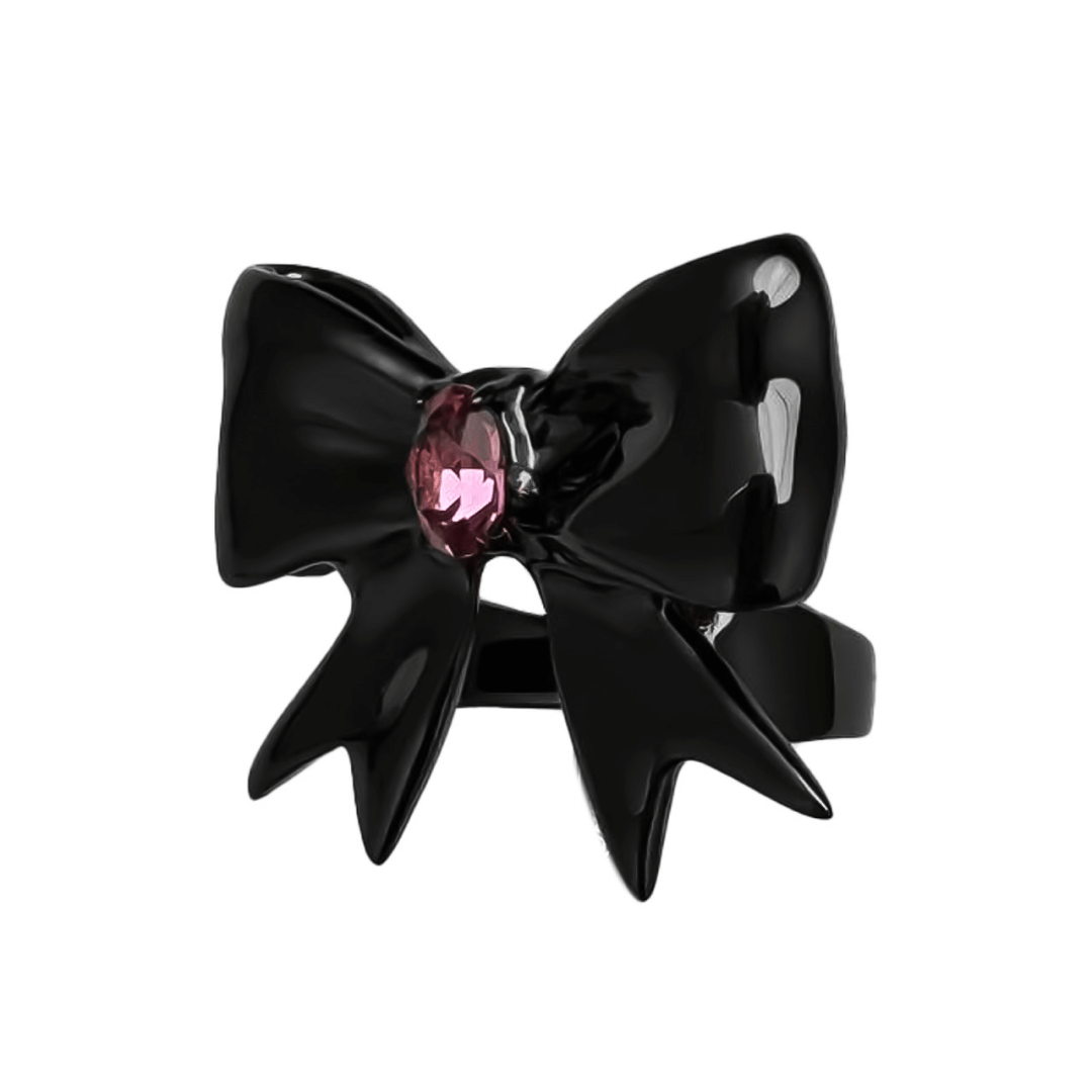 Stylish ribbon-shaped ring in silver and black with a pink Swarovski crystal accent.