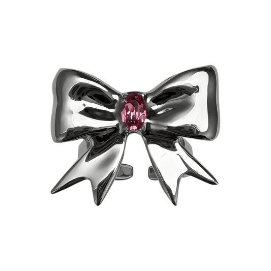 Stylish ribbon-shaped ring in silver and black with a pink Swarovski crystal accent.