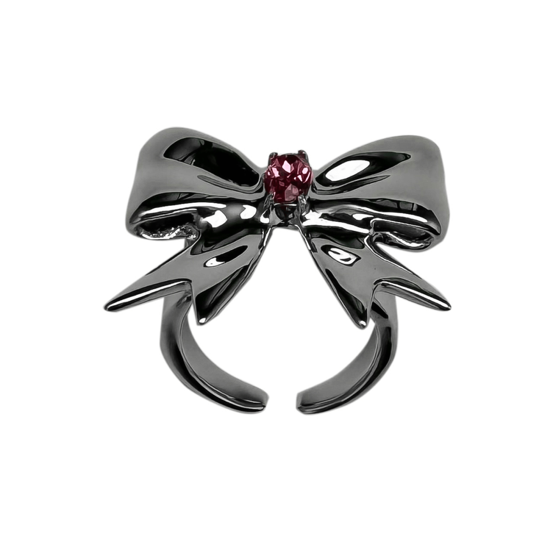 Stylish ribbon-shaped ring in silver and black with a pink Swarovski crystal accent.