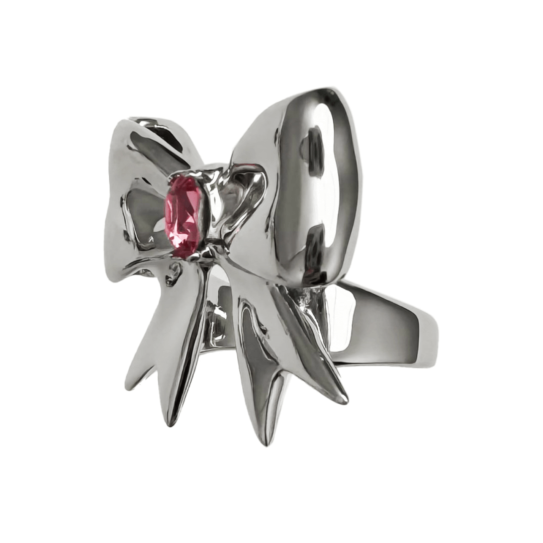 Stylish ribbon-shaped ring in silver and black with a pink Swarovski crystal accent.