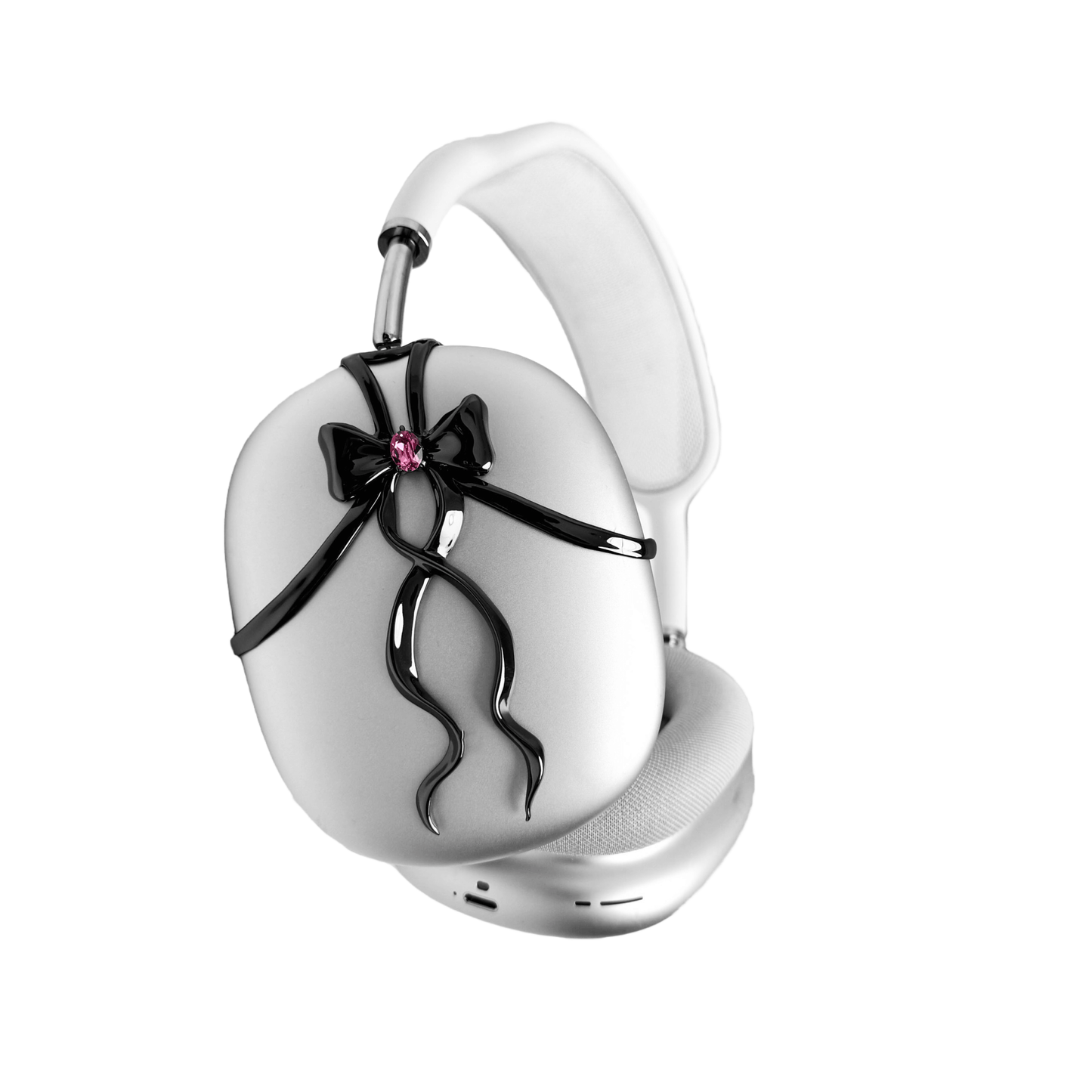 AirPods Max cover with sculpted metallic black/silver shells, adorned with a flowing 3D ribbon design and highlighted by a shimmering Pink Gem (Swarovski Crystal), creating a luxurious, statement look.