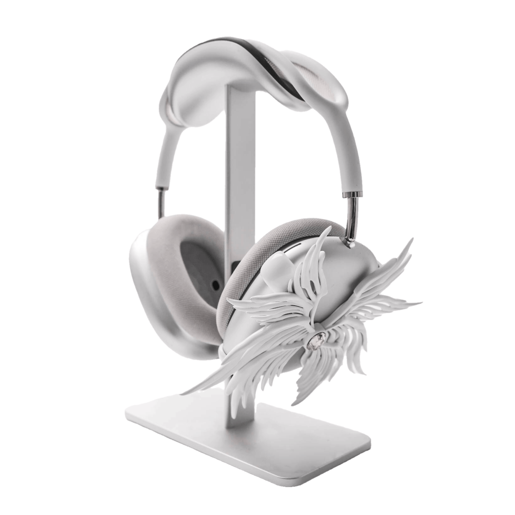 A high-fashion 3D attachment for AirPods Max headphones featuring layered, symmetrical Seraphim angel wings with a central white Swarovski crystal on each ear cup. Shown in two finish options: Reflective Silver Chrome and Matte Ethereal White.