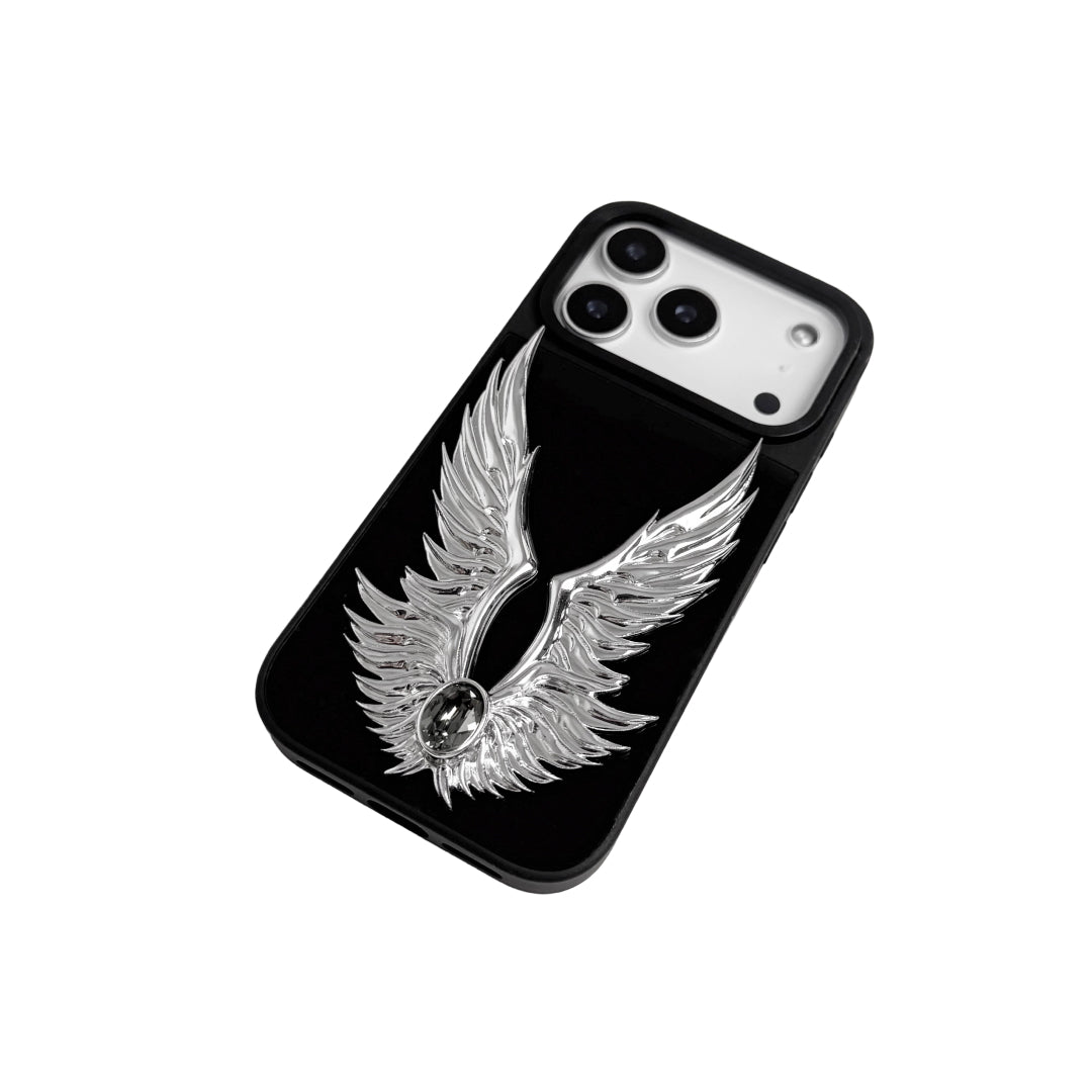 The Gem Silver Angel Wings iPhone Case featuring symmetrical 3D sculpted silver wings with a central rhinestone. Shown with both White and Black gem options, available on Silver, Transparent, and Black case bases.