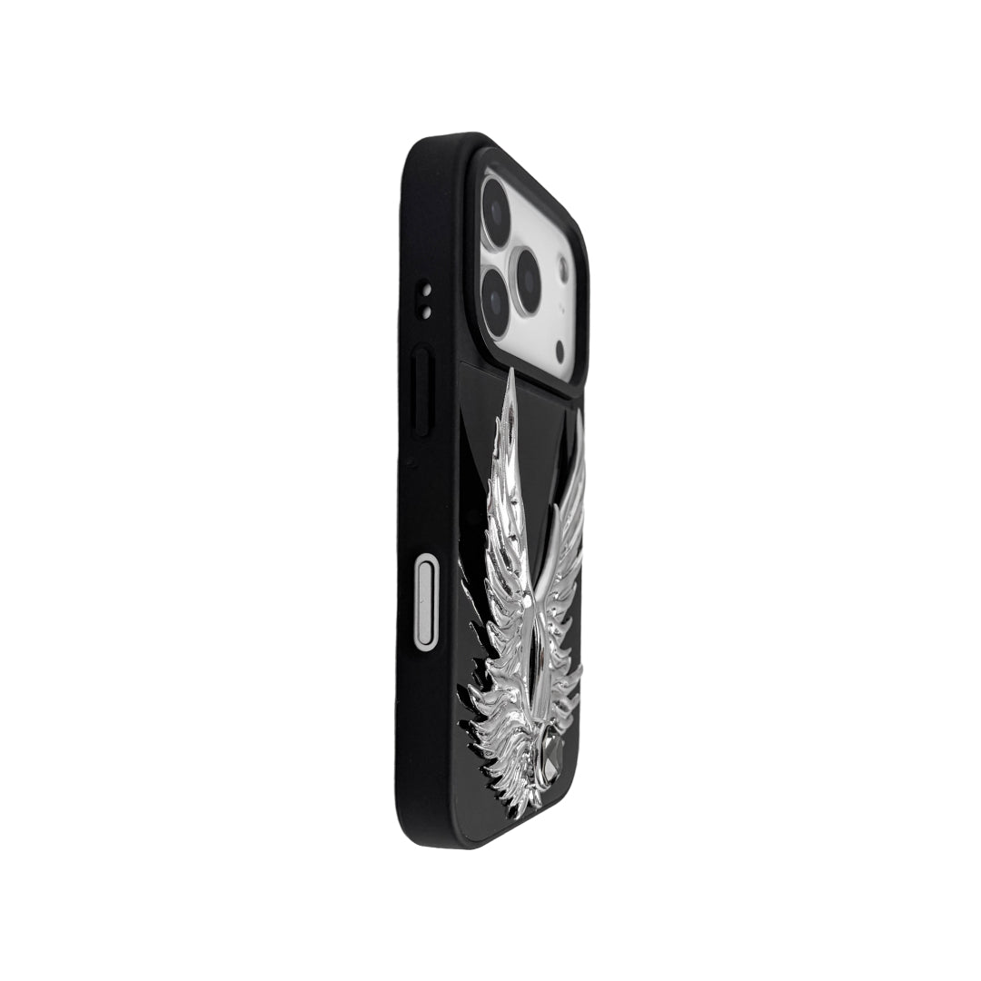 The Gem Silver Angel Wings iPhone Case featuring symmetrical 3D sculpted silver wings with a central rhinestone. Shown with both White and Black gem options, available on Silver, Transparent, and Black case bases.