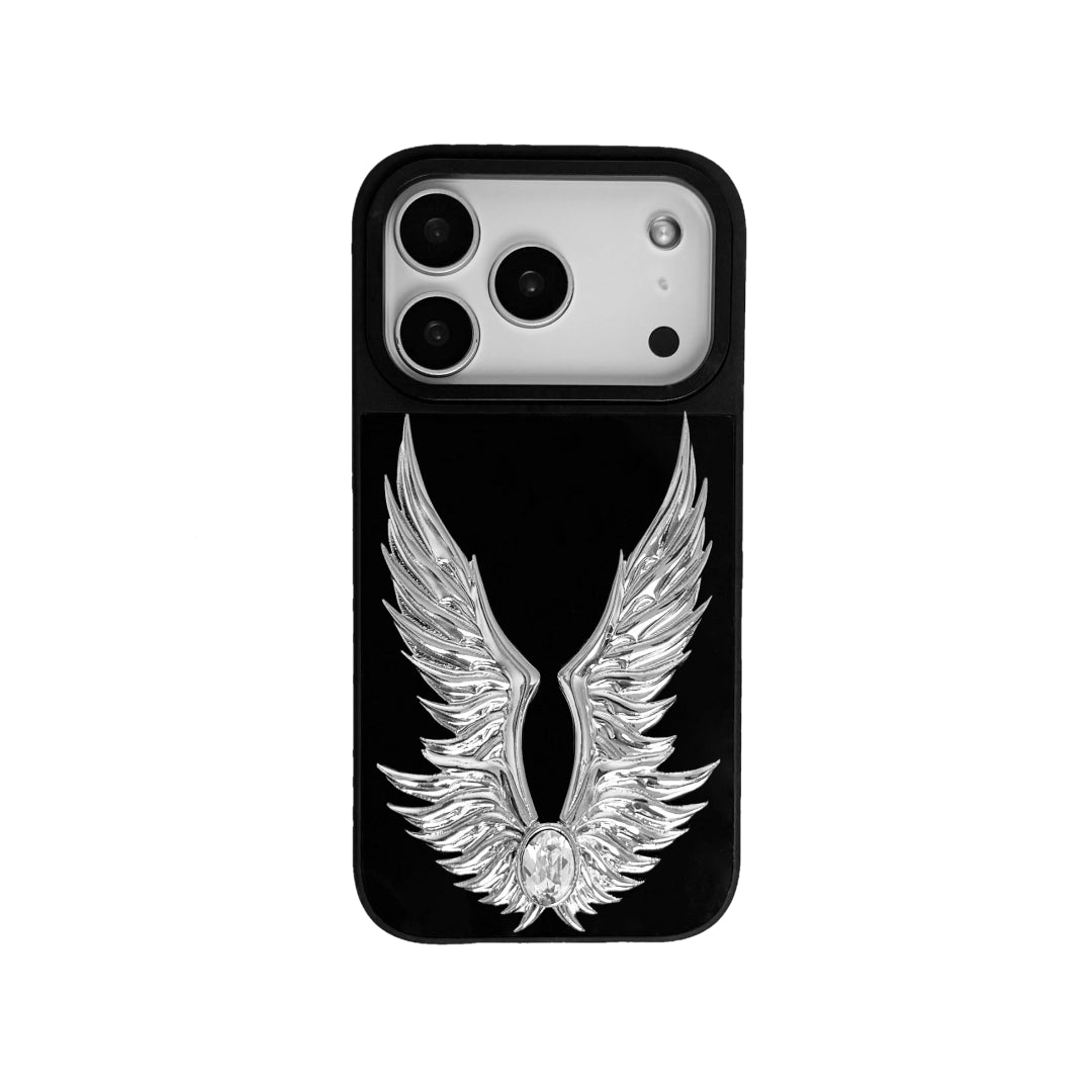 The Gem Silver Angel Wings iPhone Case featuring symmetrical 3D sculpted silver wings with a central rhinestone. Shown with both White and Black gem options, available on Silver, Transparent, and Black case bases.