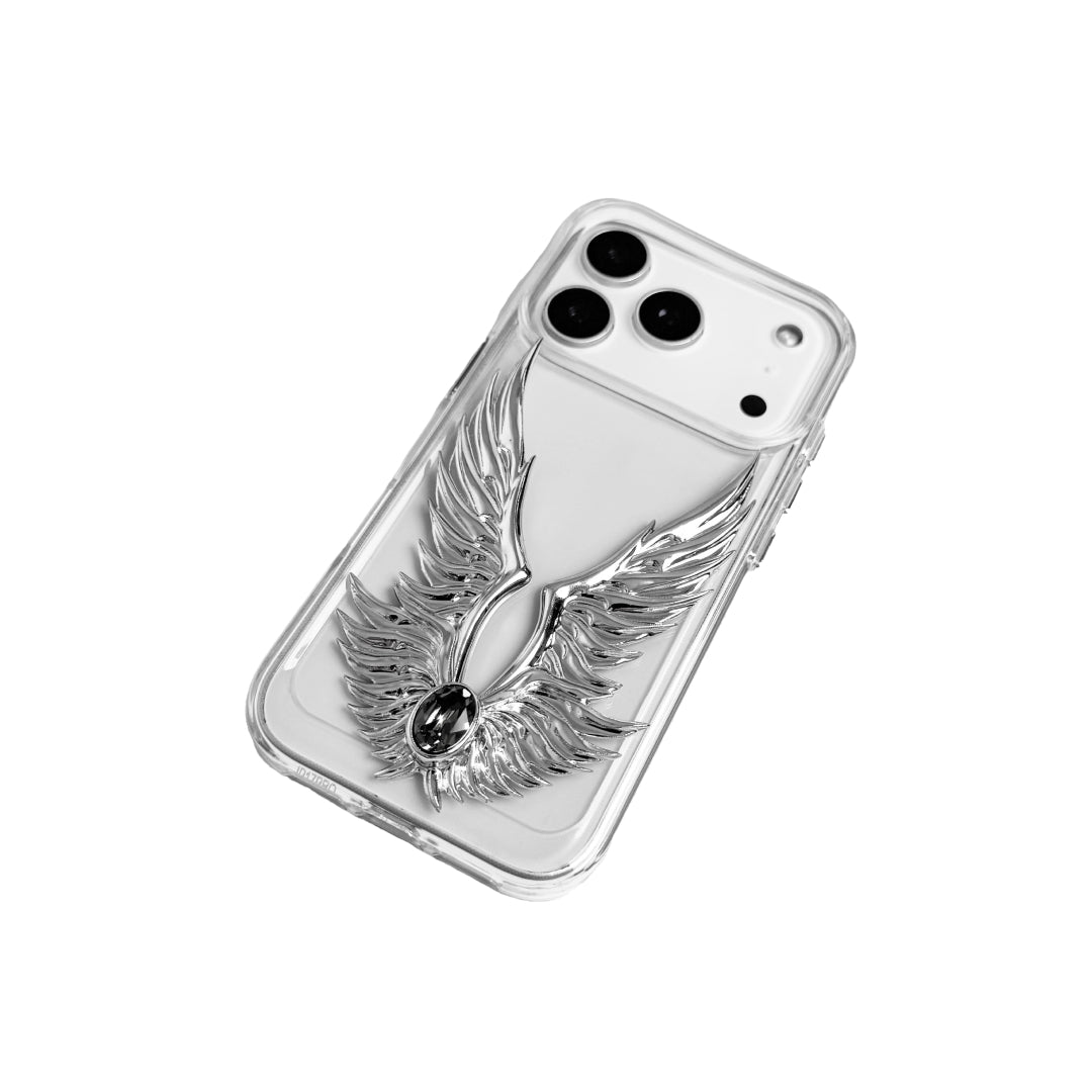 The Gem Silver Angel Wings iPhone Case featuring symmetrical 3D sculpted silver wings with a central rhinestone. Shown with both White and Black gem options, available on Silver, Transparent, and Black case bases.