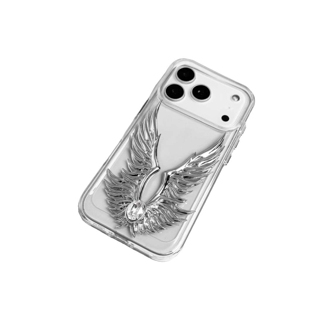 The Gem Silver Angel Wings iPhone Case featuring symmetrical 3D sculpted silver wings with a central rhinestone. Shown with both White and Black gem options, available on Silver, Transparent, and Black case bases.