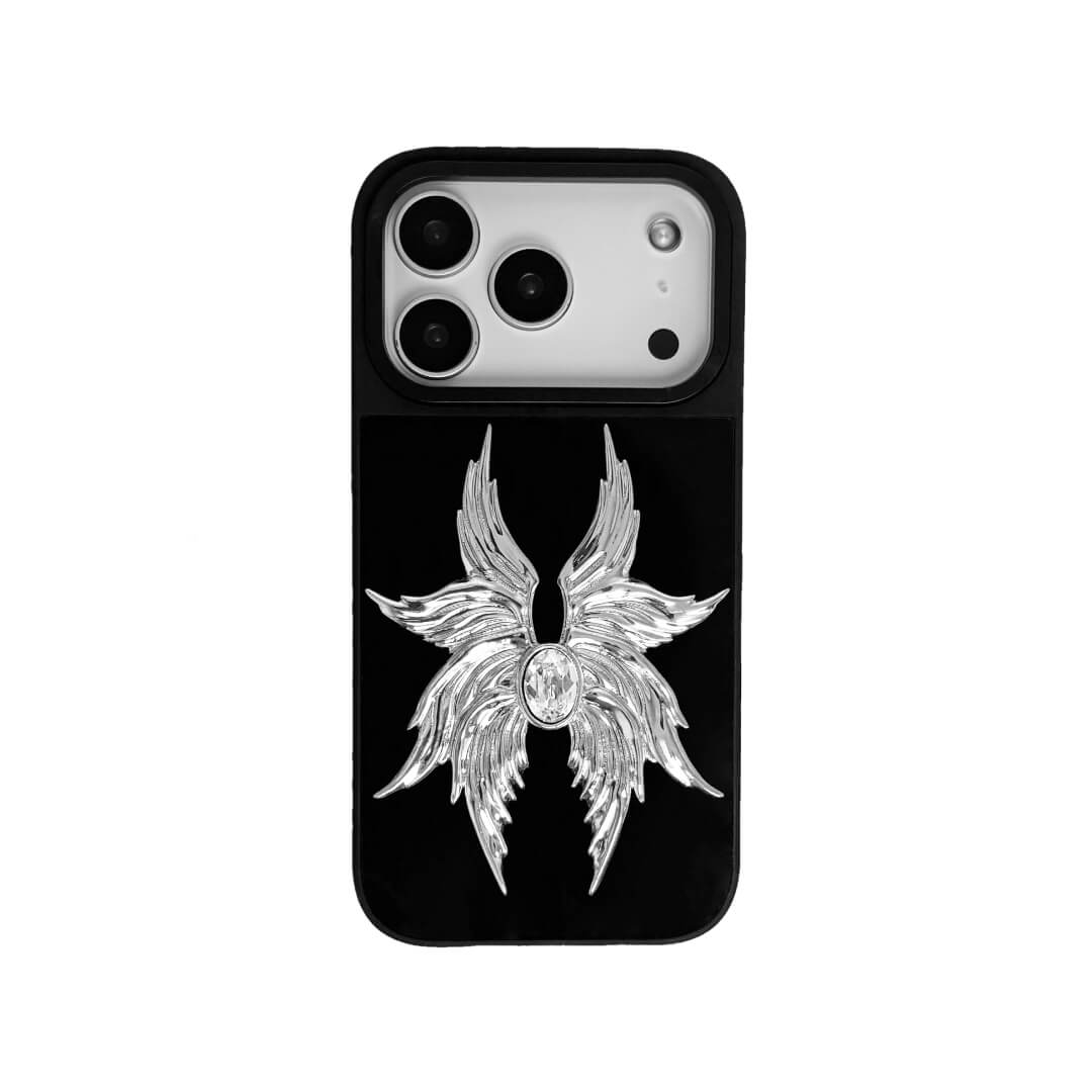 The Gem Silver Seraphim iPhone Case featuring 3D sculpted silver metallic wings with a central rhinestone. Shown with both White and Black gem options, available on Silver, Transparent, and Black case bases.