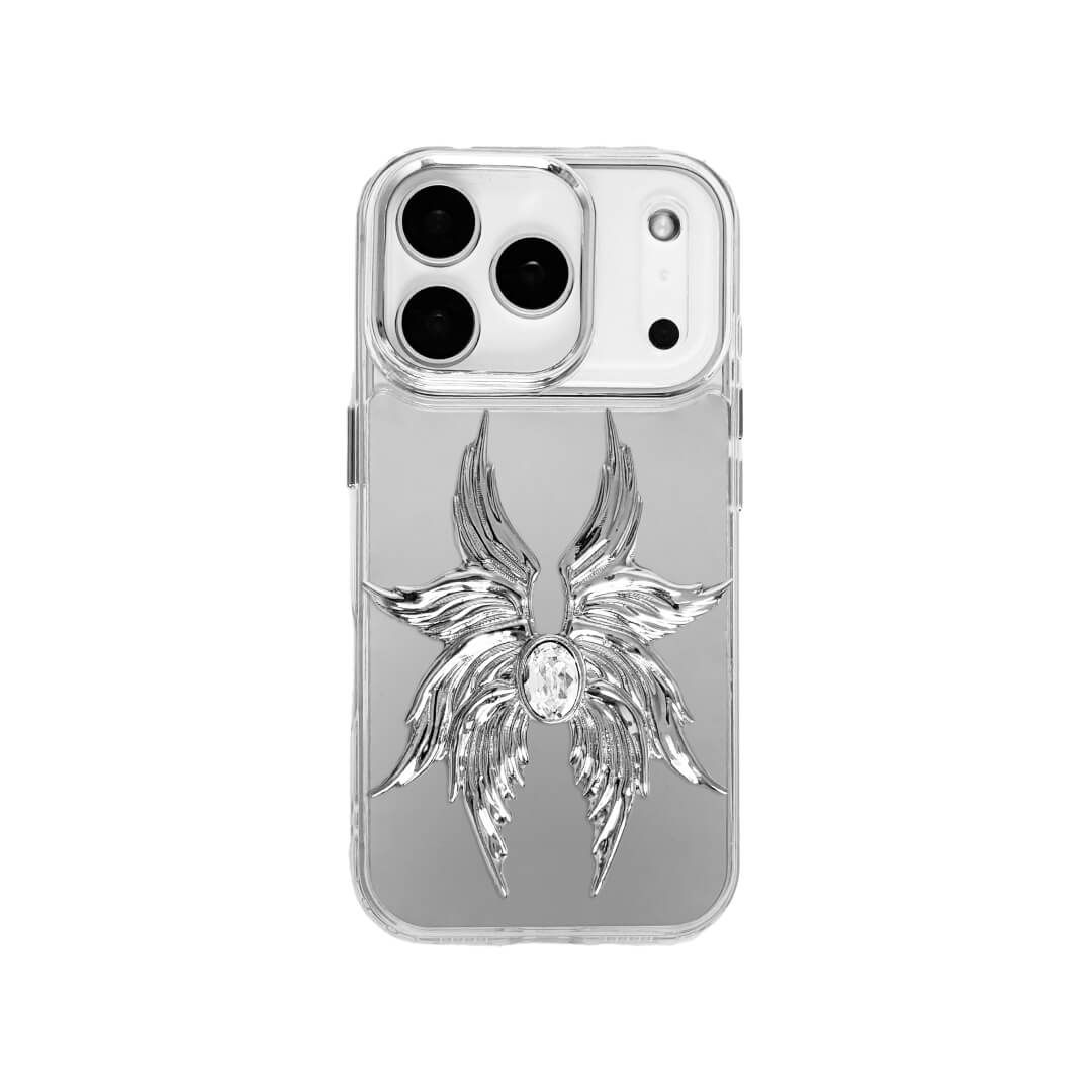 The Gem Silver Seraphim iPhone Case featuring 3D sculpted silver metallic wings with a central rhinestone. Shown with both White and Black gem options, available on Silver, Transparent, and Black case bases.