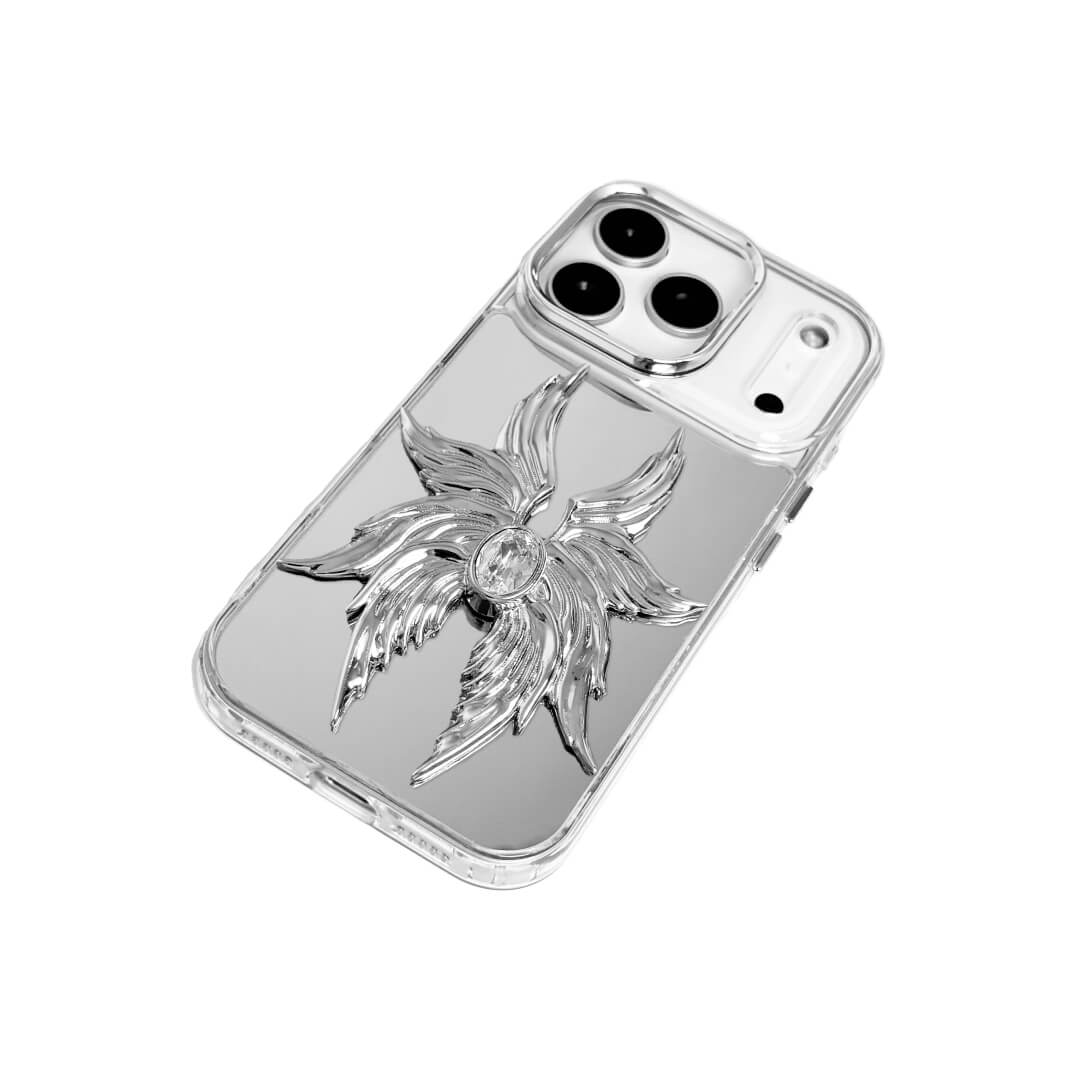The Gem Silver Seraphim iPhone Case featuring 3D sculpted silver metallic wings with a central rhinestone. Shown with both White and Black gem options, available on Silver, Transparent, and Black case bases.