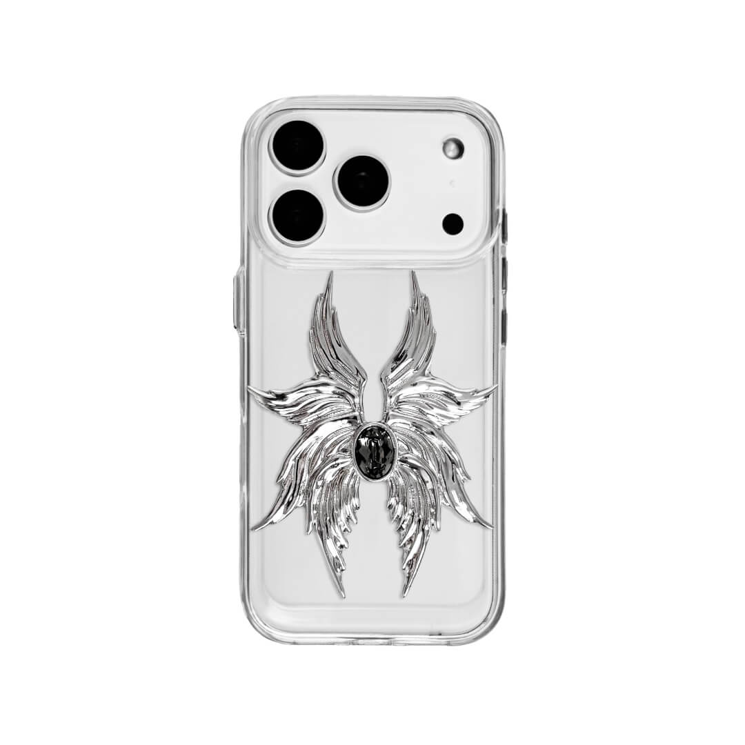 The Gem Silver Seraphim iPhone Case featuring 3D sculpted silver metallic wings with a central rhinestone. Shown with both White and Black gem options, available on Silver, Transparent, and Black case bases.