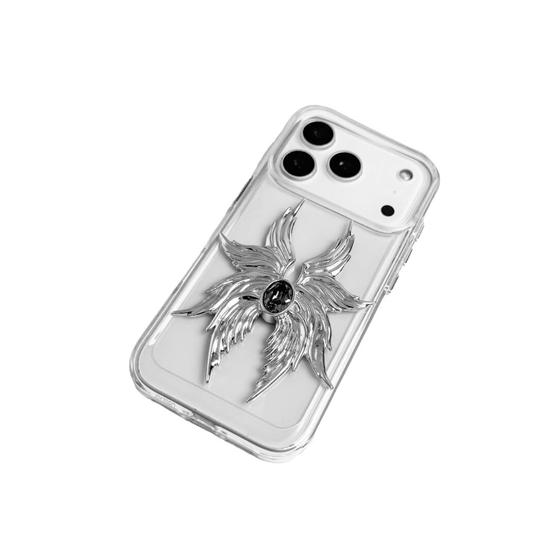 The Gem Silver Seraphim iPhone Case featuring 3D sculpted silver metallic wings with a central rhinestone. Shown with both White and Black gem options, available on Silver, Transparent, and Black case bases.