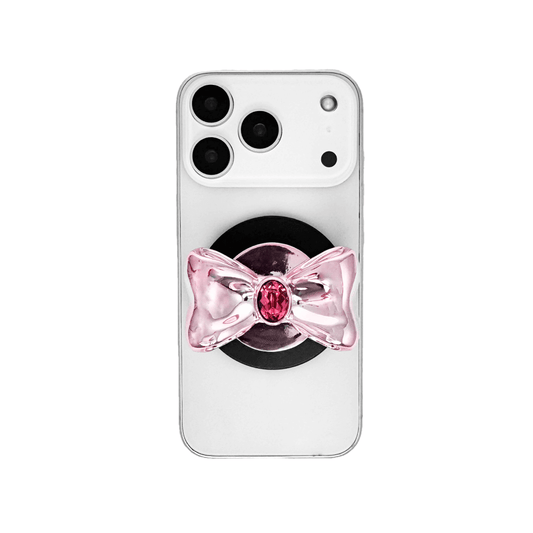 Gem Bow Phone Grip S available in silver, pink, black, and white bows, each featuring Swarovski crystal options: silver with pink, purple, white, blue, or black gems; pink with pink gem; black and white with black, white, or pink gems.