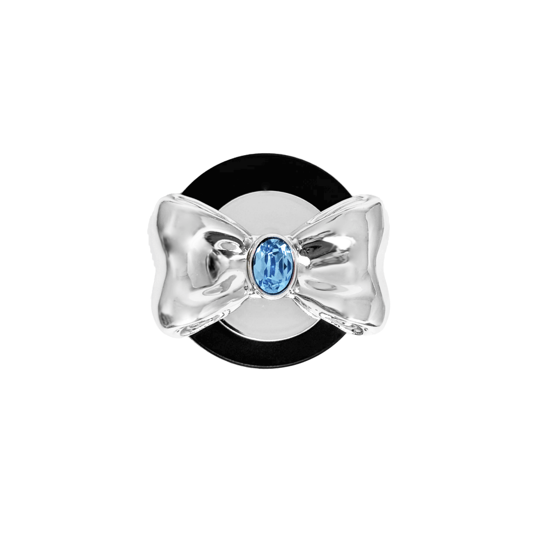 Gem Bow Phone Grip S available in silver, pink, black, and white bows, each featuring Swarovski crystal options: silver with pink, purple, white, blue, or black gems; pink with pink gem; black and white with black, white, or pink gems.