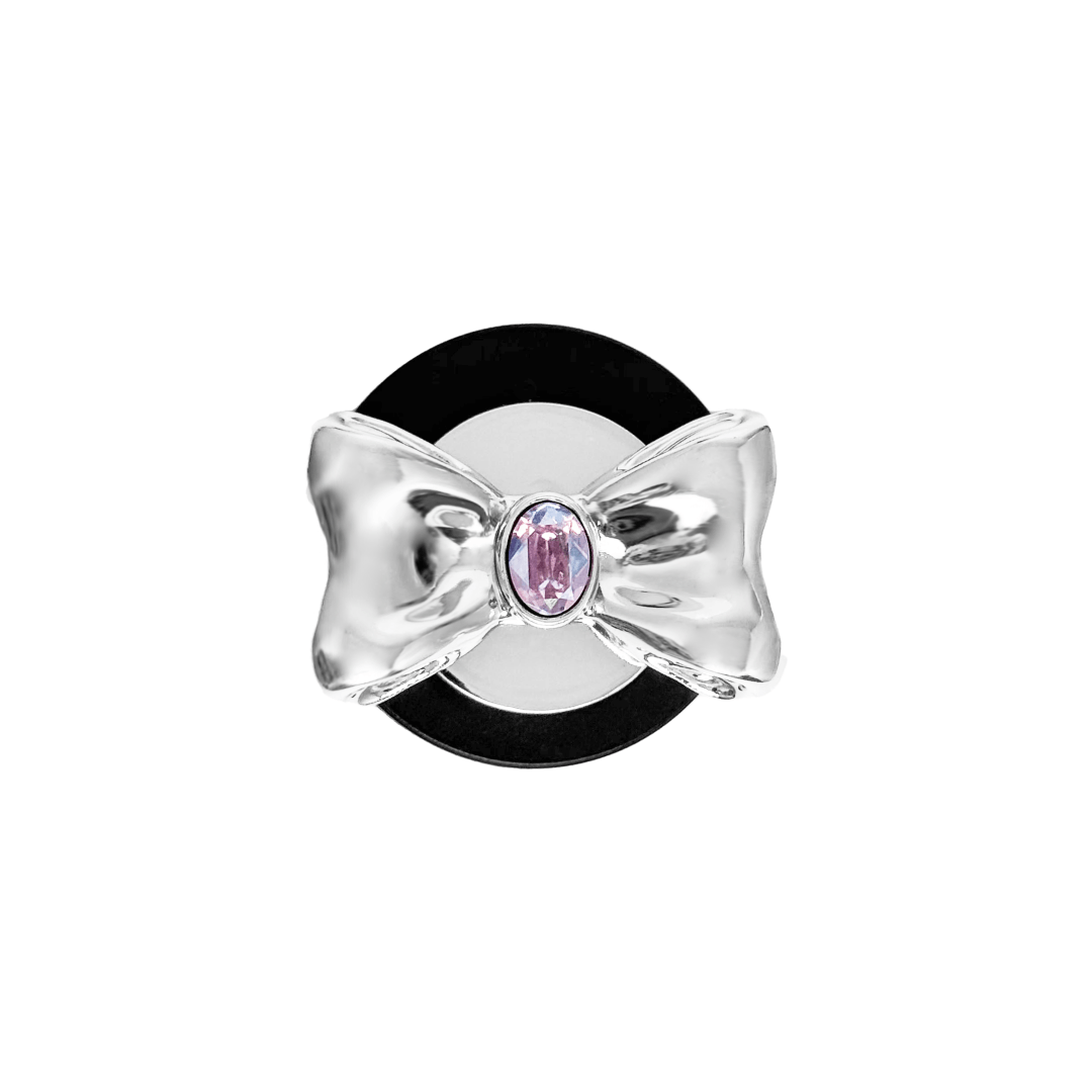 Gem Bow Phone Grip S available in silver, pink, black, and white bows, each featuring Swarovski crystal options: silver with pink, purple, white, blue, or black gems; pink with pink gem; black and white with black, white, or pink gems.