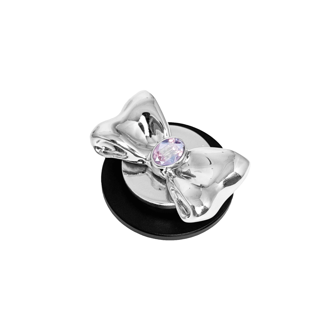 Gem Bow Phone Grip S available in silver, pink, black, and white bows, each featuring Swarovski crystal options: silver with pink, purple, white, blue, or black gems; pink with pink gem; black and white with black, white, or pink gems.