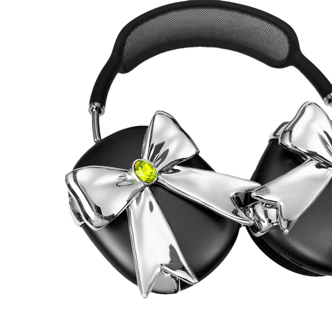 Glossy lilac AirPods Max cover with sculptural silver ribbon and gem detail – futuristic feminine tech accessory