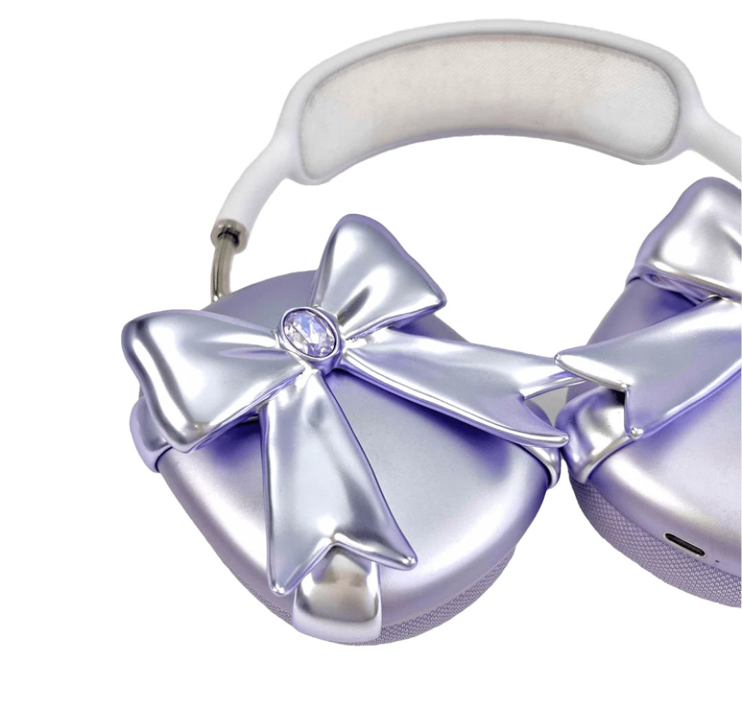 Glossy lilac AirPods Max cover with sculptural silver ribbon and gem detail – futuristic feminine tech accessory