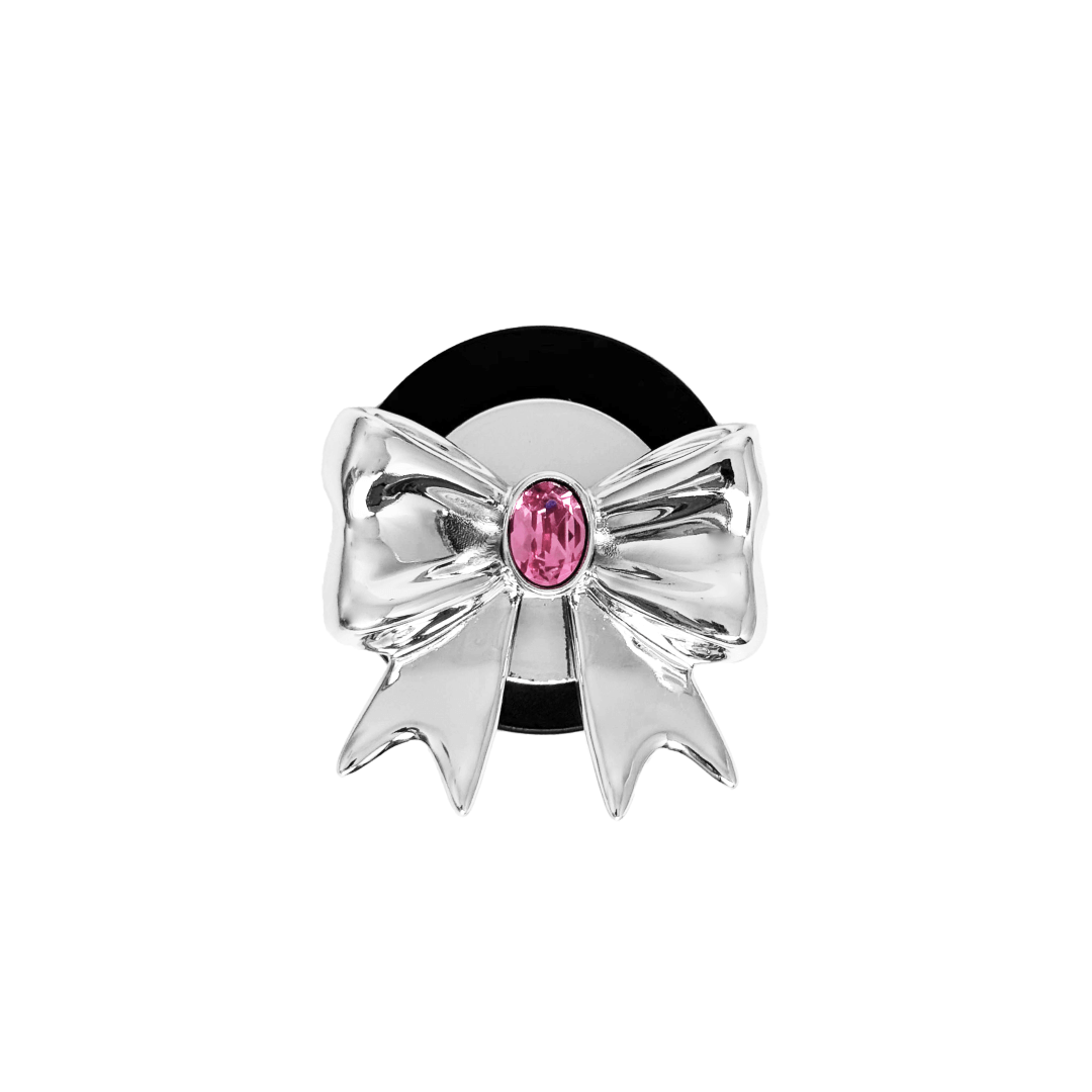 Gem Ribbon Phone Grip S available in silver, pink, black, and white ribbon designs, each featuring Swarovski crystal options: silver with pink, purple, white, blue, or black gems; pink with pink gem; black and white with black, white, or pink gems.