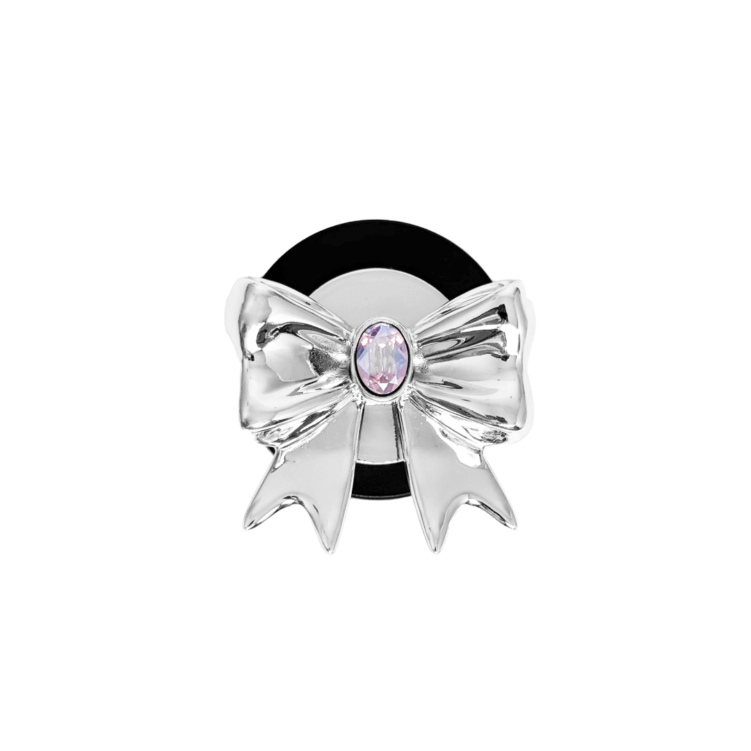 Gem Ribbon Phone Grip S available in silver, pink, black, and white ribbon designs, each featuring Swarovski crystal options: silver with pink, purple, white, blue, or black gems; pink with pink gem; black and white with black, white, or pink gems.