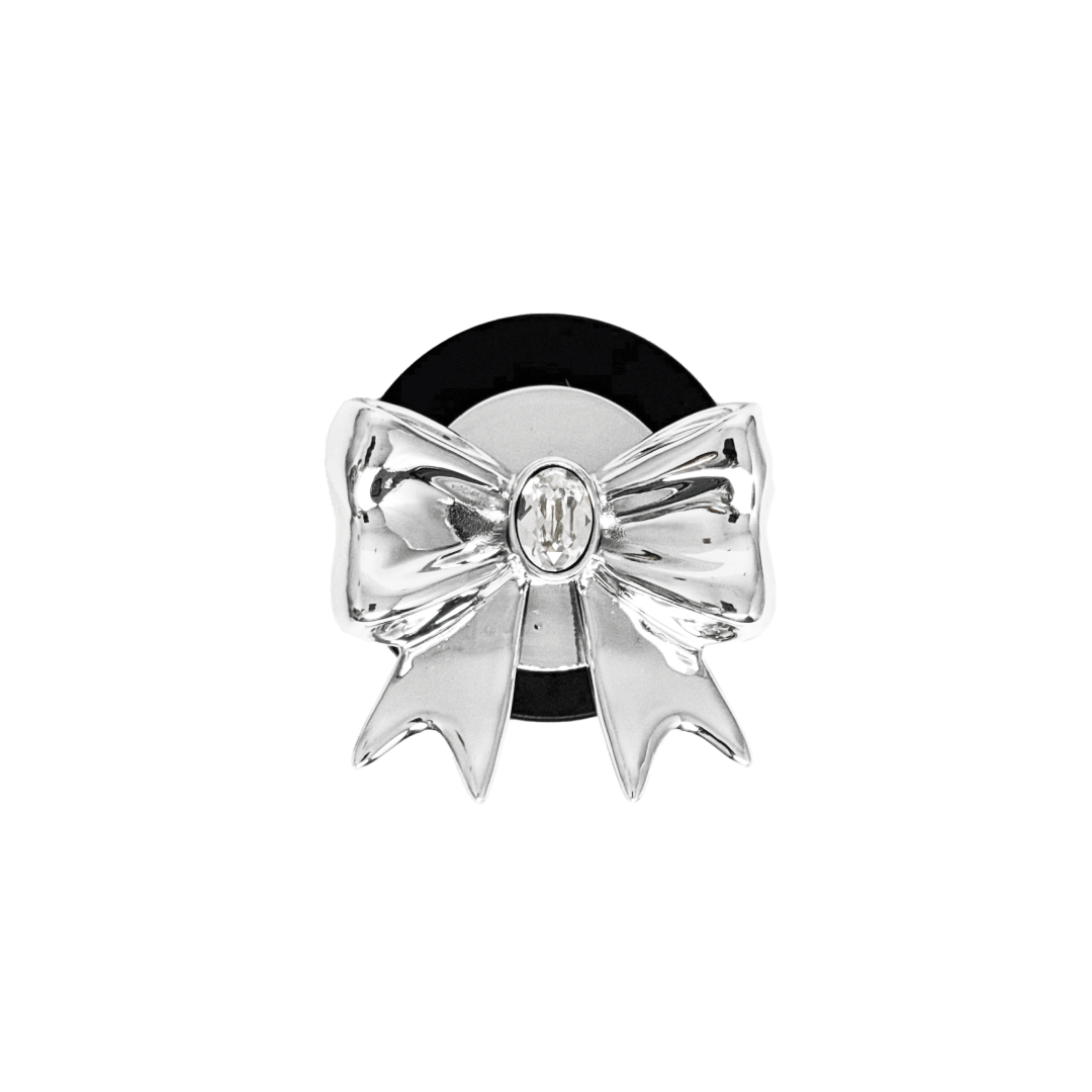 Gem Ribbon Phone Grip S available in silver, pink, black, and white ribbon designs, each featuring Swarovski crystal options: silver with pink, purple, white, blue, or black gems; pink with pink gem; black and white with black, white, or pink gems.