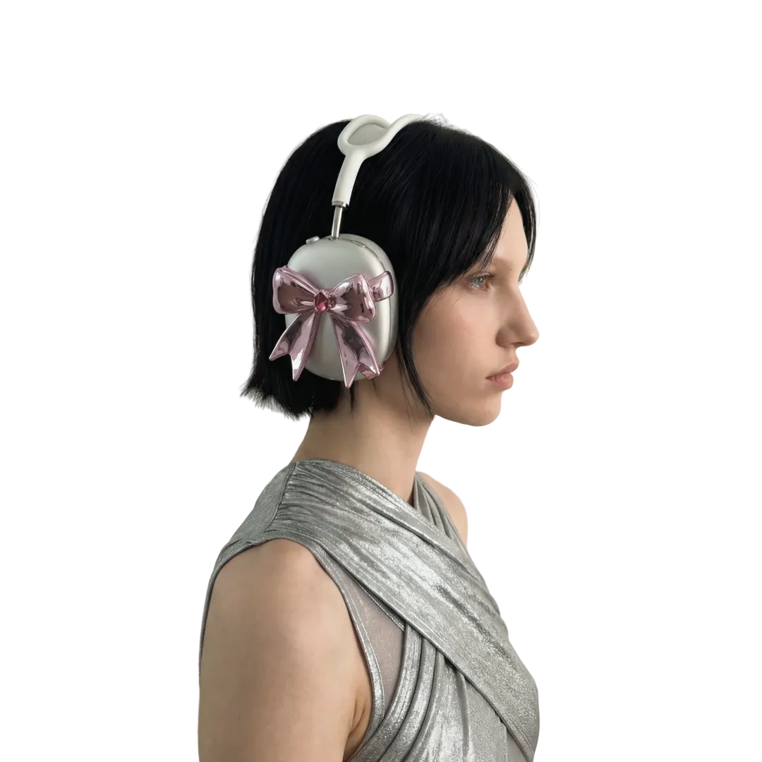 Person wearing headphones with a pink bow, against a plain background