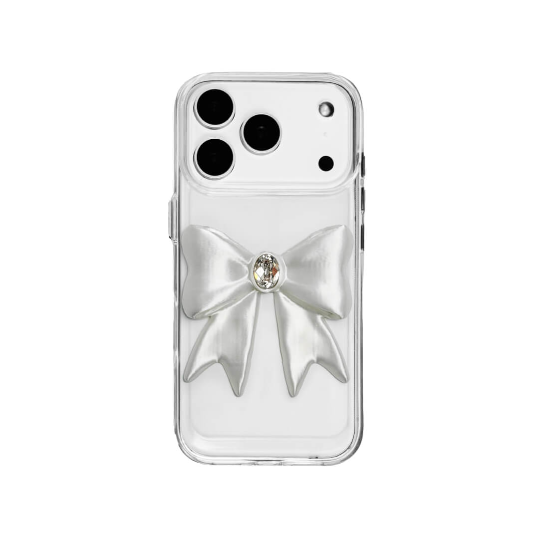 The Glossy White Gem Bow iPhone Case featuring the stunning 3D sculpted white bow with a central gem embellishment, shown on both the Crystal Clear (Transparent) and White Leather Texture base options.