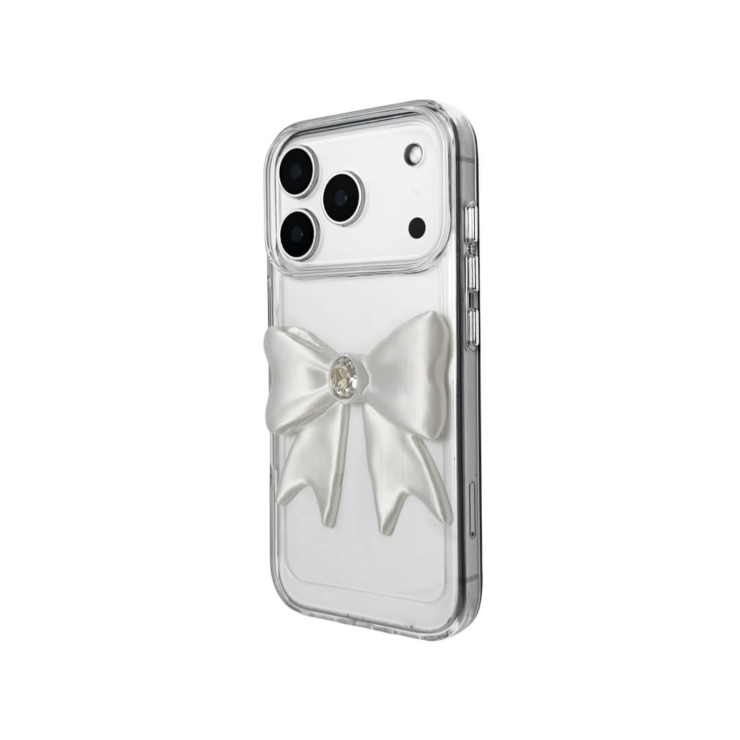 The Glossy White Gem Bow iPhone Case featuring the stunning 3D sculpted white bow with a central gem embellishment, shown on both the Crystal Clear (Transparent) and White Leather Texture base options.