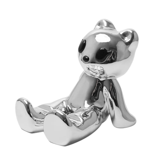 The Sculpted Gummy Bear Phone Stand collection, featuring substantial 3D bear figurines in both reflective Silver Chrome and sleek Glossy Black finishes. Designed as desktop holders to securely support mobile devices in both portrait and landscape orientations.