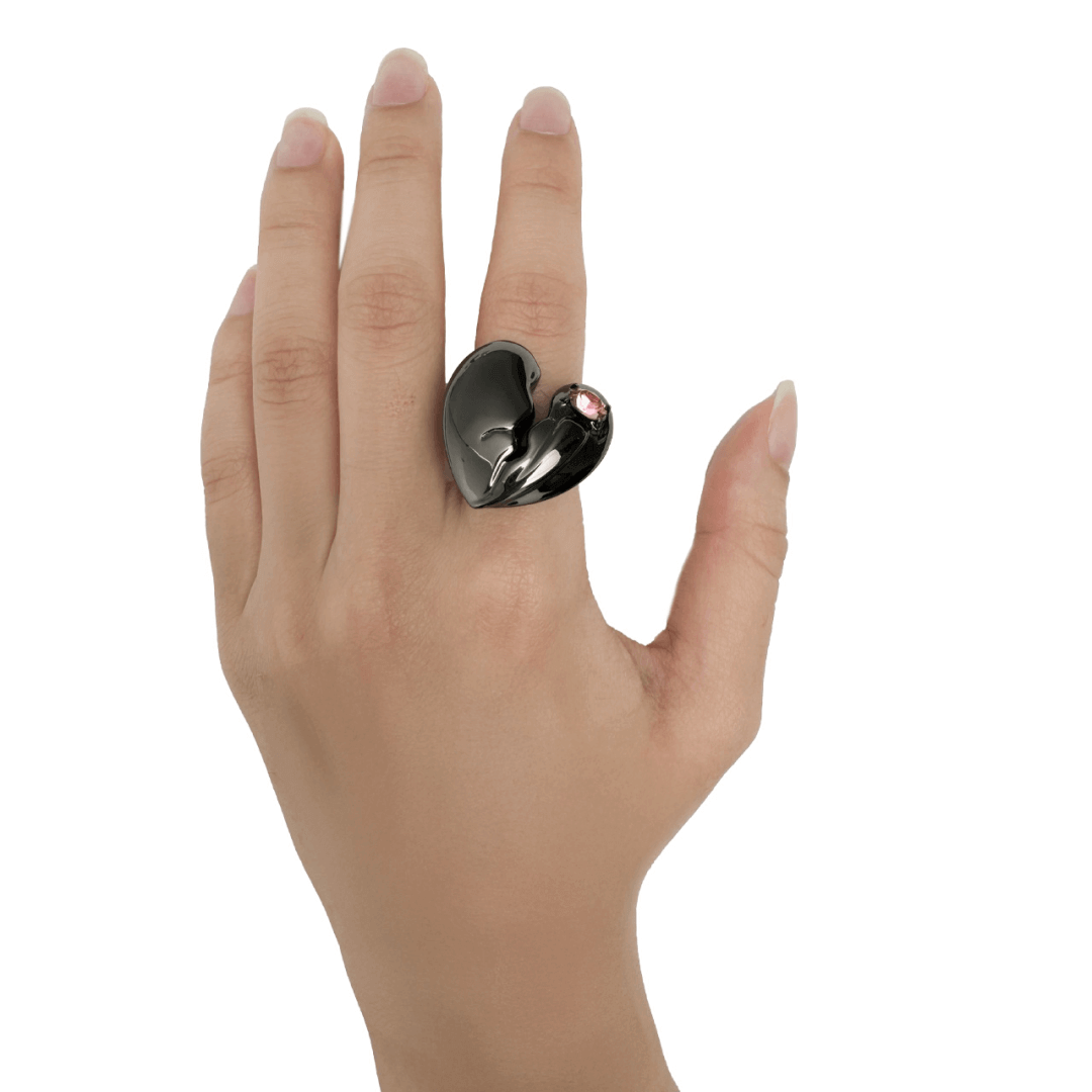 Slim band ring with a broken heart design and a pink Swarovski crystal centerpiece.