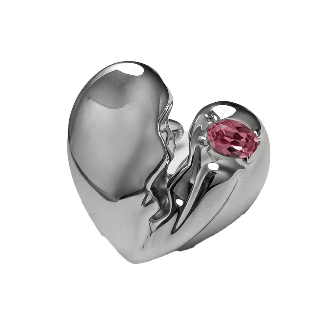 Slim band ring with a broken heart design and a pink Swarovski crystal centerpiece.