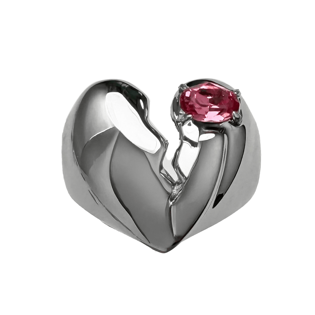 Wide band ring with a broken heart design and a pink Swarovski crystal centerpiece.
