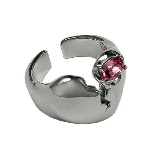 Wide band ring with a broken heart design and a pink Swarovski crystal centerpiece.