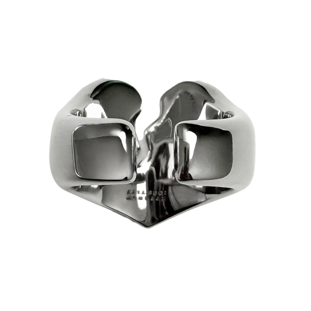 Wide band ring with a broken heart design and a pink Swarovski crystal centerpiece.