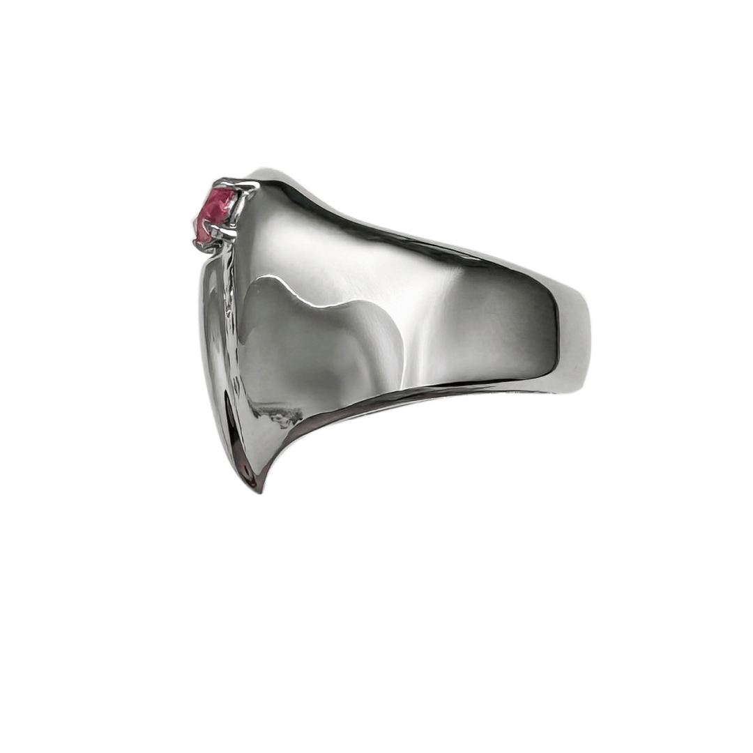 Wide band ring with a broken heart design and a pink Swarovski crystal centerpiece.