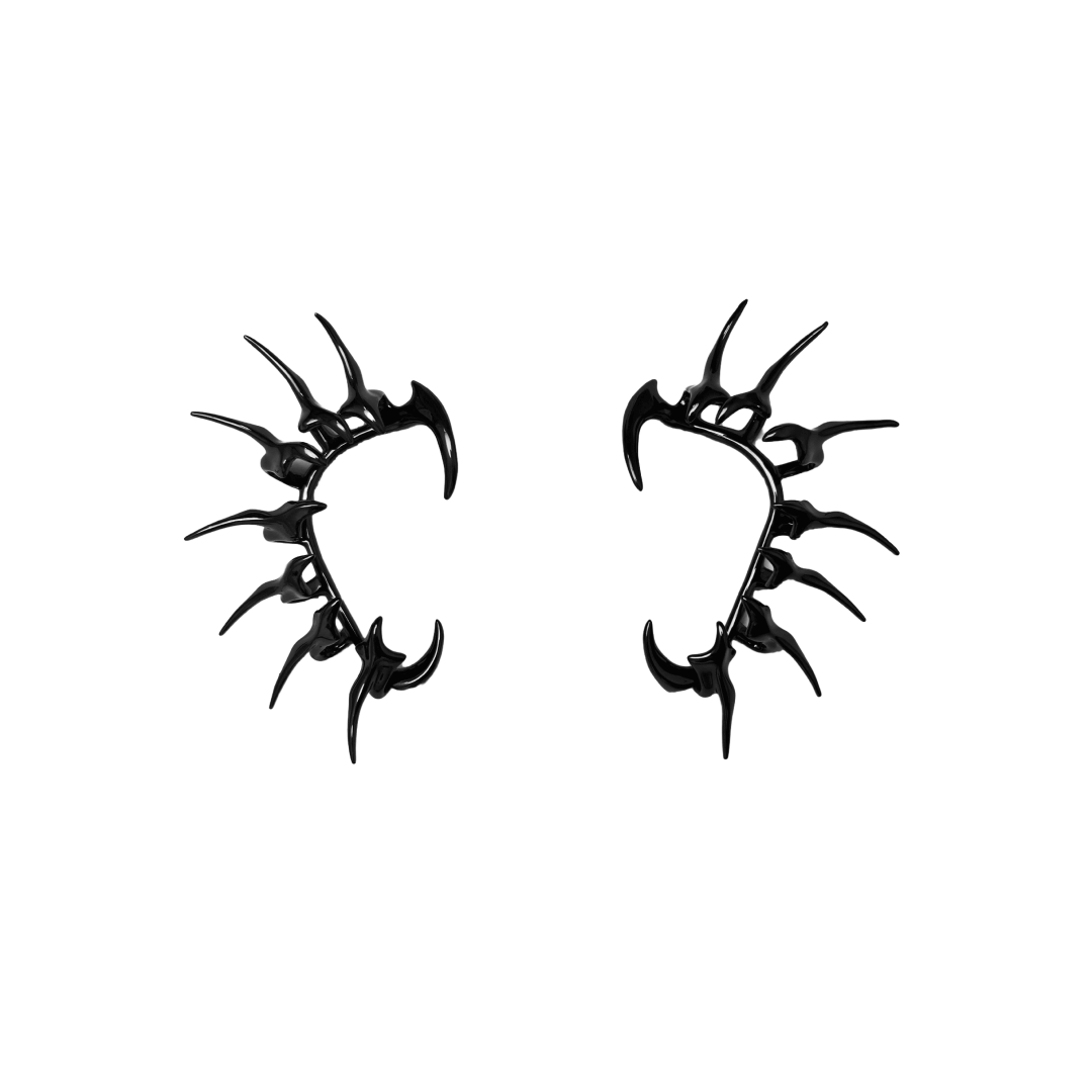 Horn Ear Cuffs — spiked ear cuffs featuring a curved horn-like silhouette, available in black and silver, blending mythic edge with modern minimalism.