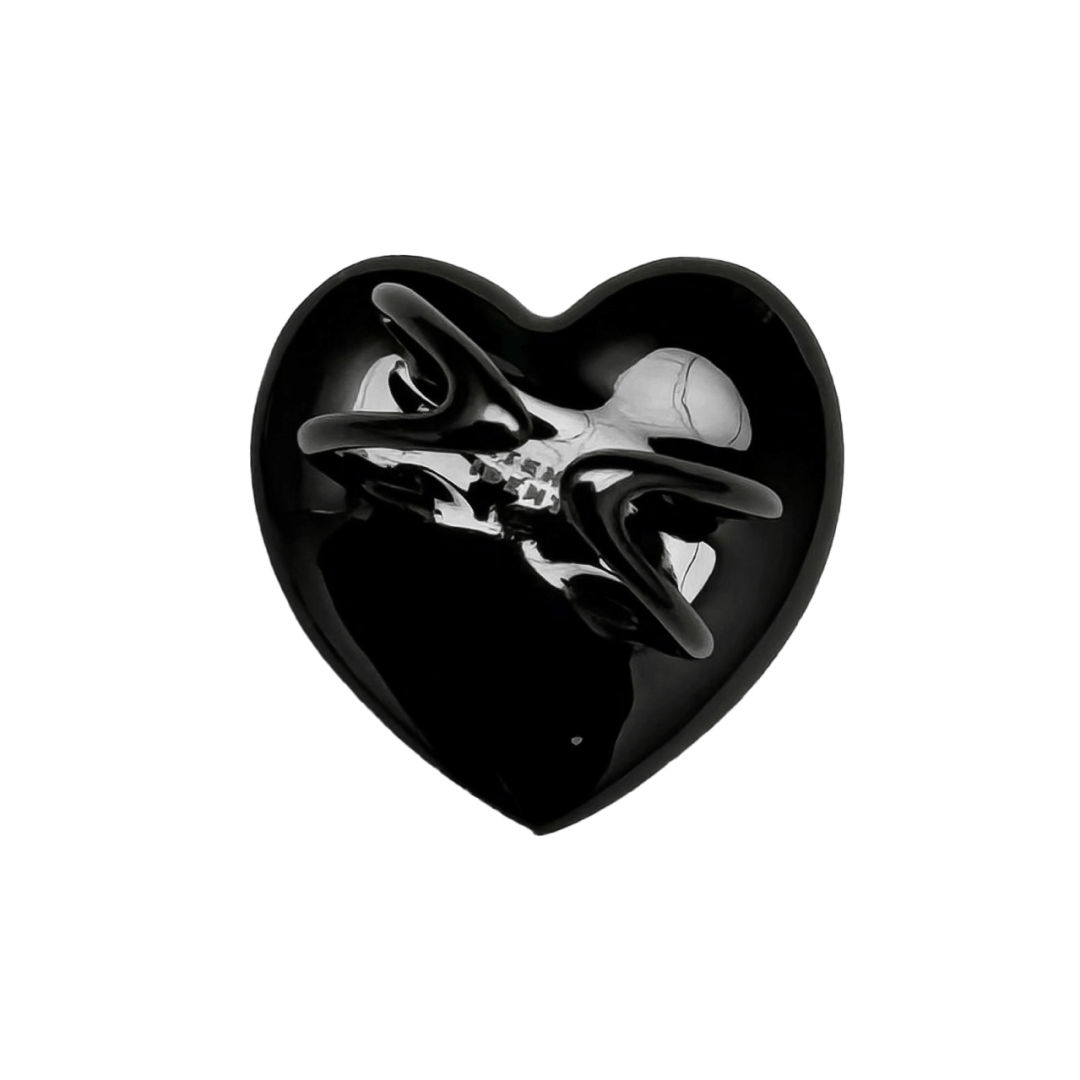 Slim band ring with a heart-shaped design and a pink Swarovski crystal centerpiece.