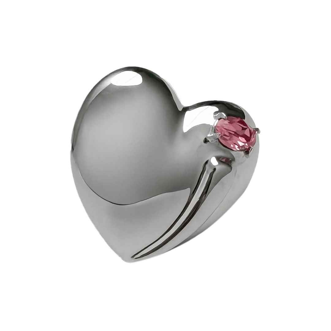 Slim band ring with a heart-shaped design and a pink Swarovski crystal centerpiece.