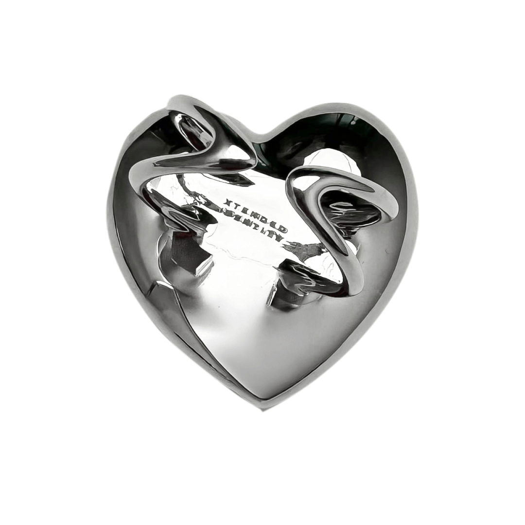 Slim band ring with a heart-shaped design and a pink Swarovski crystal centerpiece.