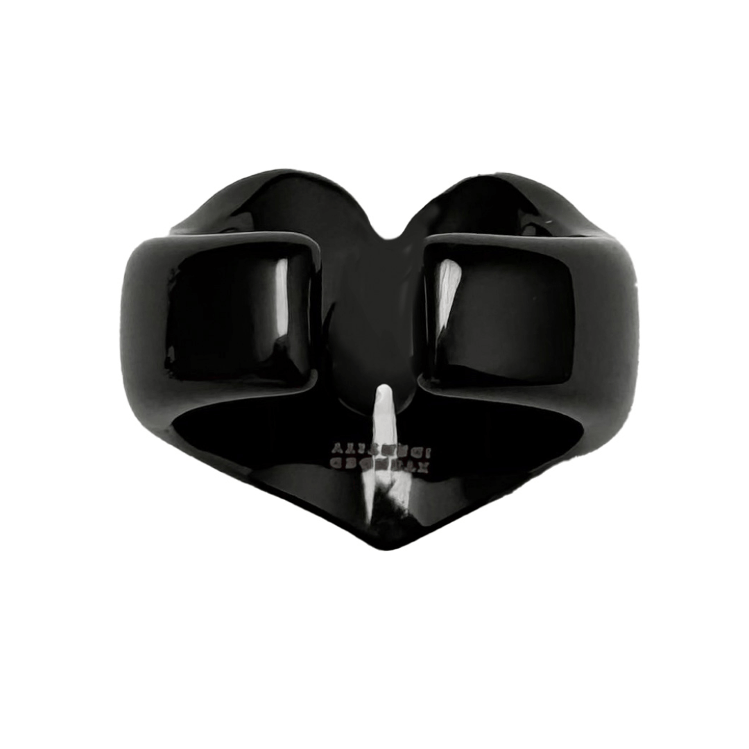 Wide band ring with a heart-shaped design and a pink Swarovski crystal centerpiece.