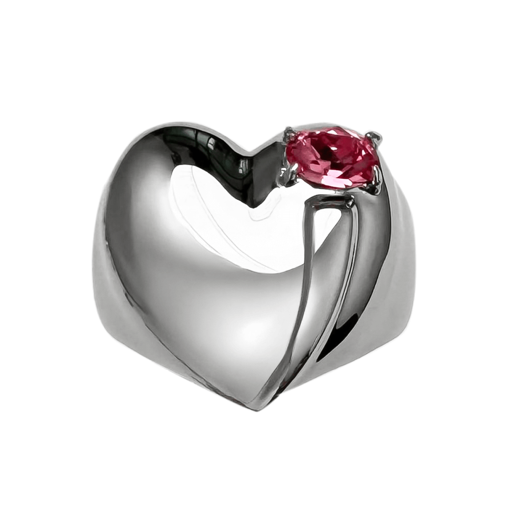 Wide band ring with a heart-shaped design and a pink Swarovski crystal centerpiece.