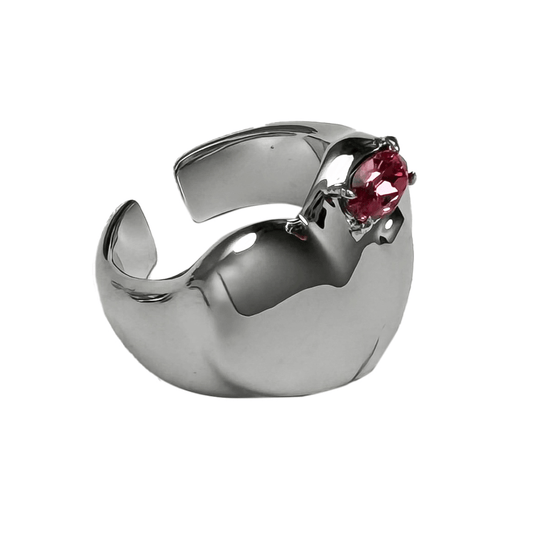 Wide band ring with a heart-shaped design and a pink Swarovski crystal centerpiece.
