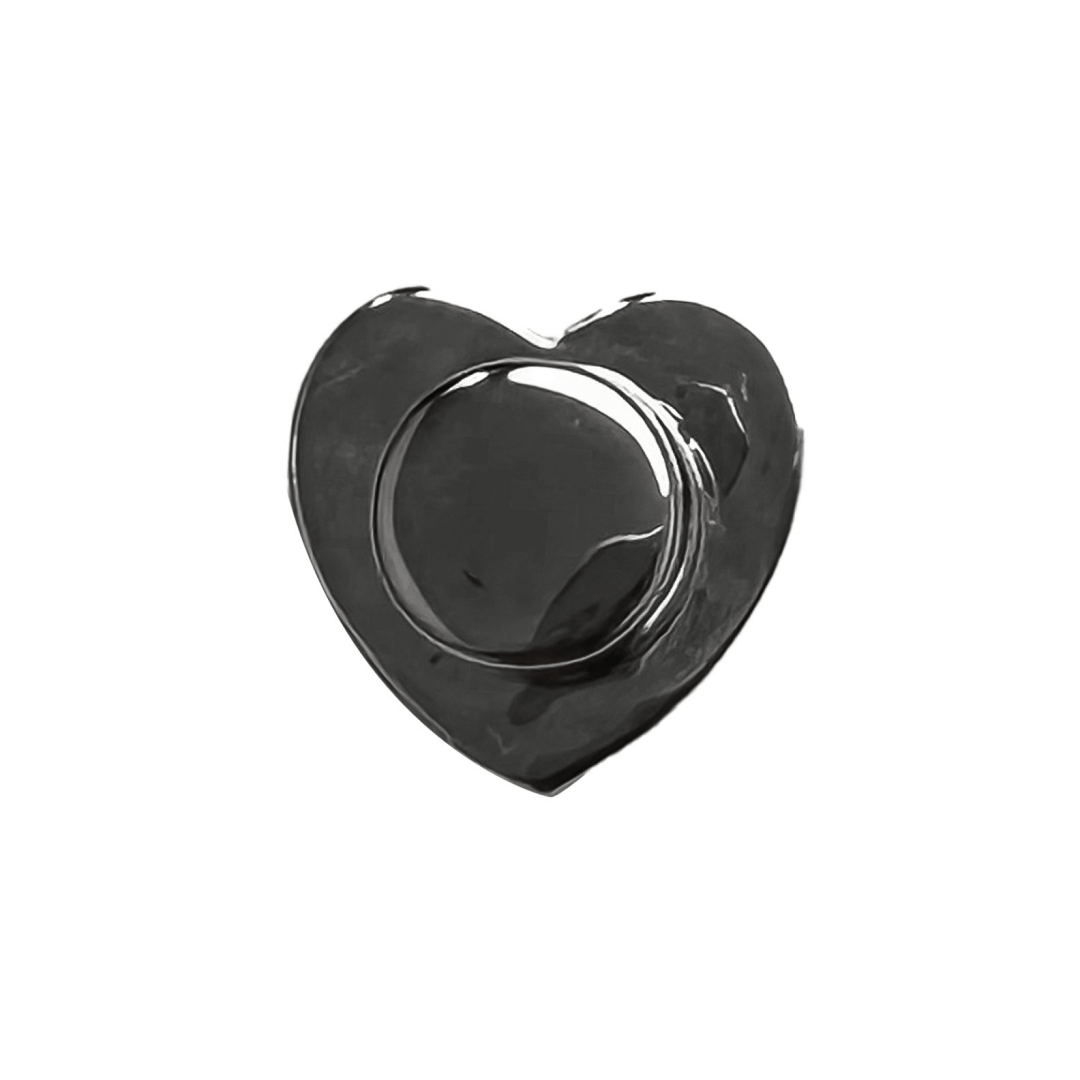 A silver metallic heart-shaped shoelace charm designed to slide onto shoelaces, adding a touch of elegance and playful style to sneakers.