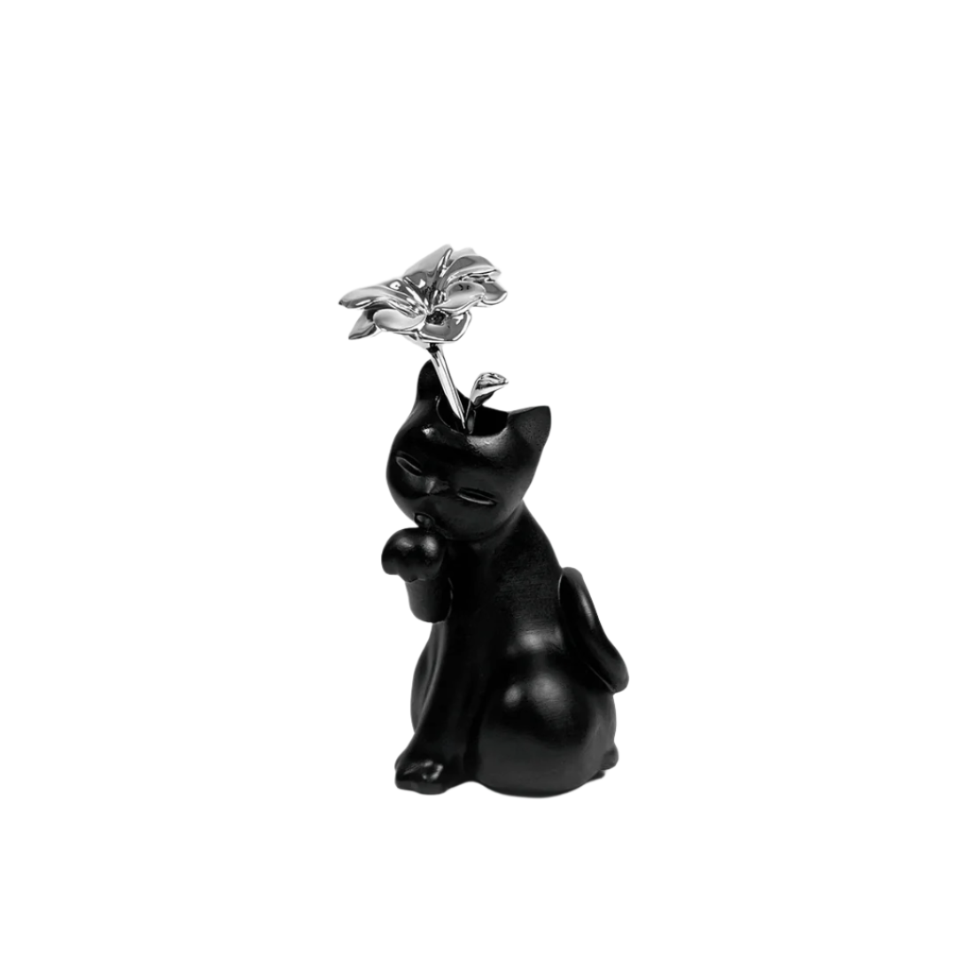 Futuristic matte-black cat vase with glossy chrome flower bloom – sleek sculptural contrast of textures in totemic lucky cat form