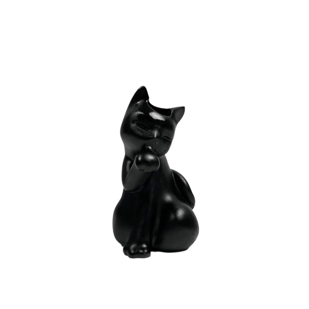 Futuristic matte-black cat vase with glossy chrome flower bloom – sleek sculptural contrast of textures in totemic lucky cat form