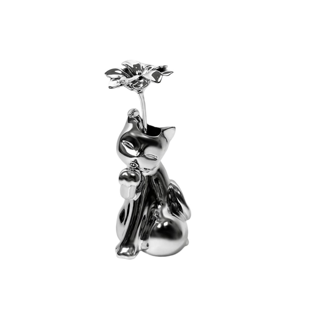 Futuristic chrome cat vase with sleek sculptural curves – metallic finish with abstracted lucky cat silhouette and hollowed floral opening